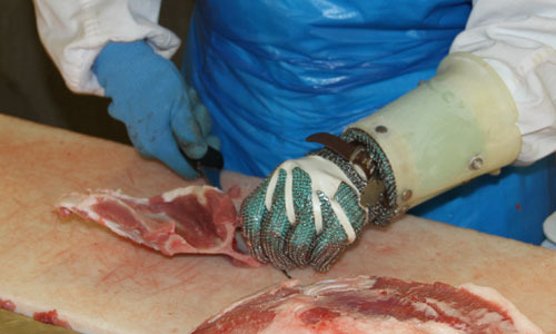 Manipulaci&oacute;n de carne en una sala de despiece
