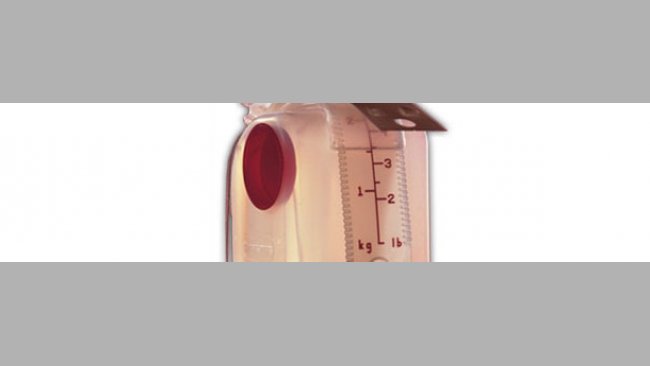 Dosificador de pienso con escala de ajuste en kg y lb.