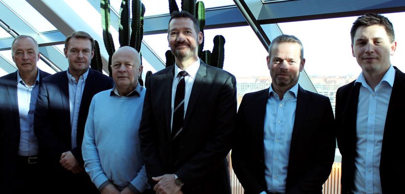 A satisfied group on the 19th of March following the sale of DK-Foods to Danish Crown and Tulip Food Company. From the left is seen Tulip's CFO Henrik Weihrauch, the board members Per Fischer Larsen and Steffen Ramsgaard from DK-Foods, Tulip's CEO Kasper Lenbroch, partner Per Høholt from May Invest Equity and Kasper Orloff, who is the VP Corporate Secretary at Danish Crown.