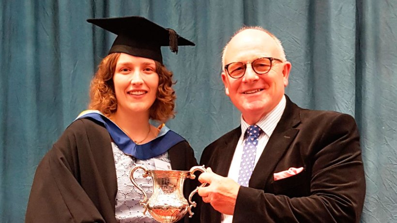 Olivia Hartshorn being presented with the Nick Bird Award by Farmex managing director, Hugh Crabtree, at a ceremony at Harper Adams University.