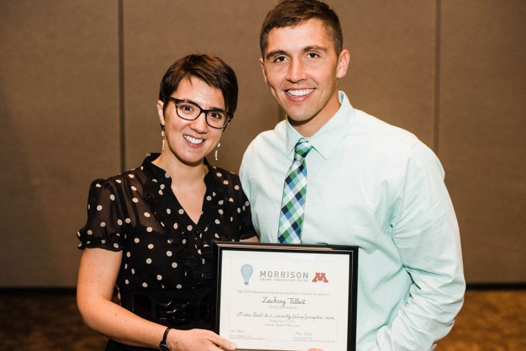 Zack Talbert received the Morrison Swine Innovator Prize from Dr. Perle Zhitnitskiy
