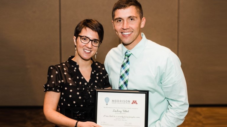 University of Minnesota veterinary professor Perle Zhitnitskiy, DVM, MSpVM, congratulates Zack Talbert, a University of Illinois veterinary student who won the annual Morrison Swine Innovator Prize.
