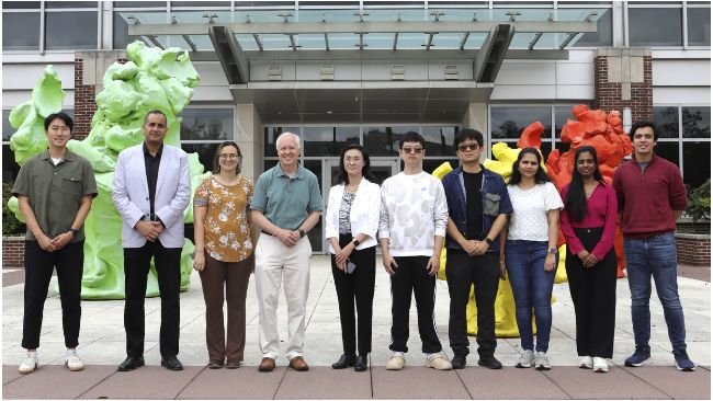 Brian Cunningham, Intel Alumni Endowed Chair of Electrical and Computer Engineering, and Ying Fang, professor of pathobiology in the College of Veterinary Medicine (center) and lab members to develop portable point-of-use biosensor for detection of African swine fever virus in farm environments.