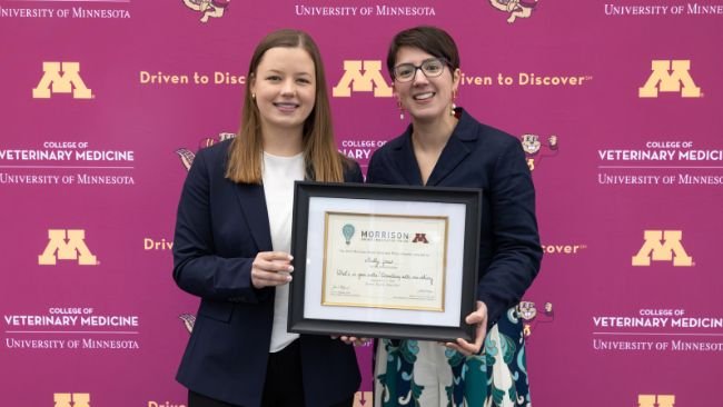 North Carolina State University veterinary student Molly Jones (left) is presented with the Morrison Swine Innovator Prize by Perle Zhitnitskiy, associate professor at the University of Minnesota College of Veterinary Medicine, on Sept. 21 at the Allen D. Leman Swine Conference in St. Paul, Minnesota.