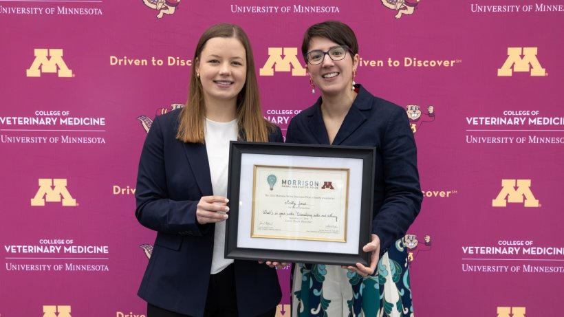 North Carolina State University veterinary student Molly Jones (left) is presented with the Morrison Swine Innovator Prize by Perle Zhitnitskiy, associate professor at the University of Minnesota College of Veterinary Medicine, on Sept. 21 at the Allen D. Leman Swine Conference in St. Paul, Minnesota.